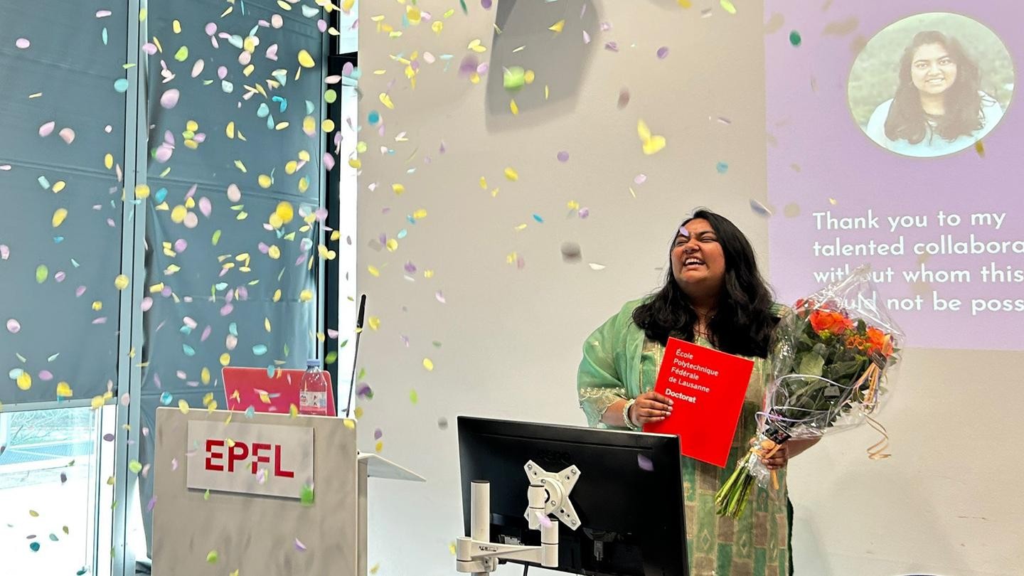 Vinitra celebrating her thesis defense at EPFL